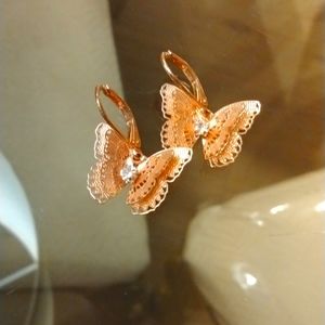Rose golden butterfly with small diamond earrings.